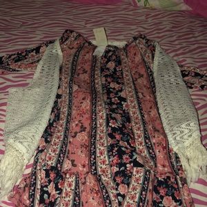 a flowy long sleeve shirt with a white cardigan